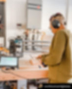 Woman using here Onefinity CNC machine.