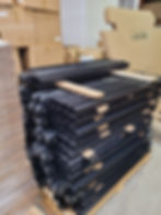 Stack of QCW parts in a warehouse